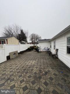 view of patio / terrace featuring fence