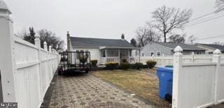 view of property exterior with fence