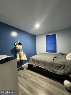 bedroom with wood finished floors