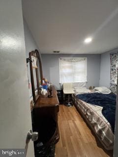 bedroom featuring wood finished floors