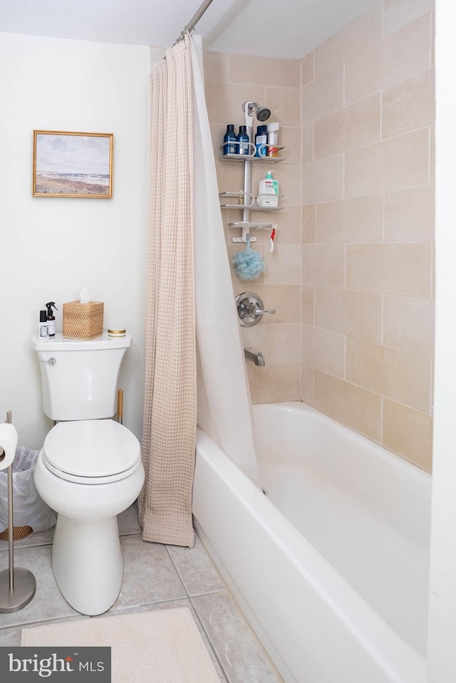 full bathroom with toilet, shower / tub combo, and tile patterned flooring