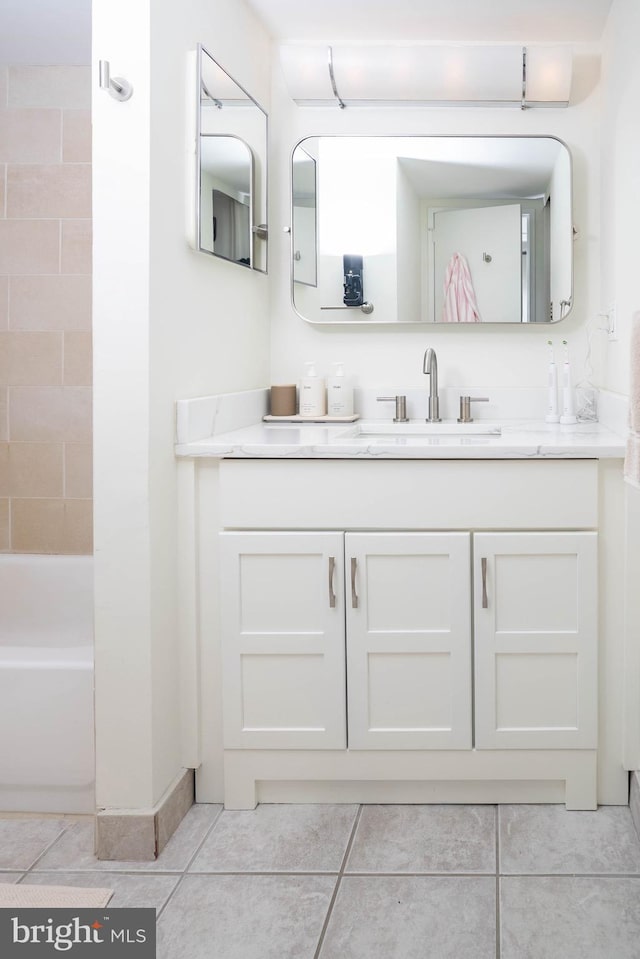 full bathroom with bathing tub / shower combination, vanity, and tile patterned floors