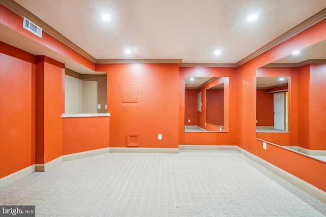 spare room featuring recessed lighting, carpet flooring, visible vents, baseboards, and crown molding