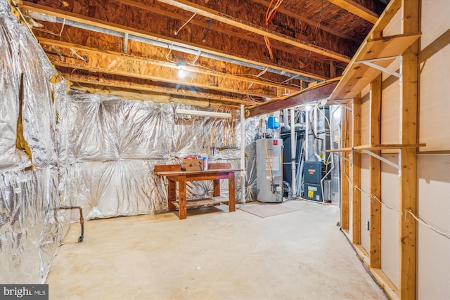 unfinished basement with gas water heater and heating unit