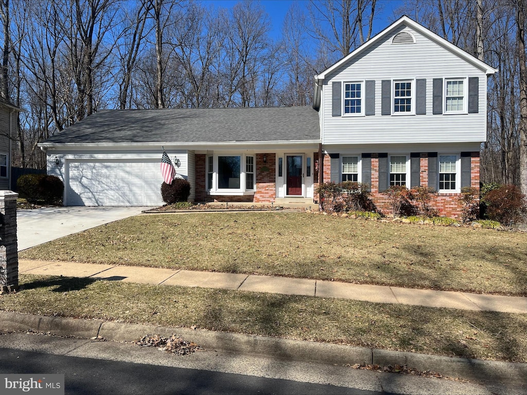 view of front of home with a shingled roof, concrete driveway, an attached garage, a front lawn, and brick siding