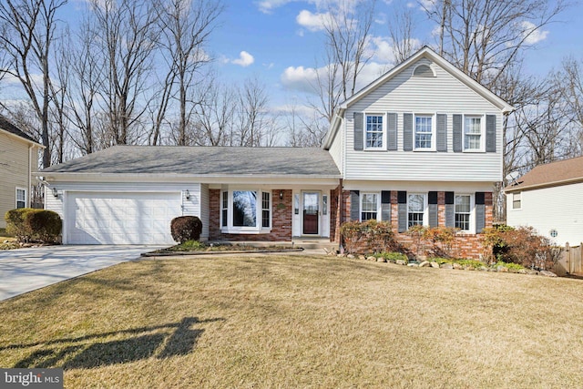 view of front of property with a front lawn, concrete driveway, brick siding, and an attached garage