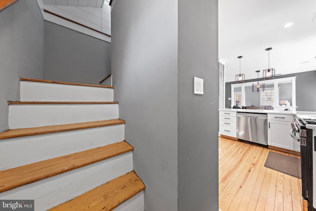 stairs with wood finished floors