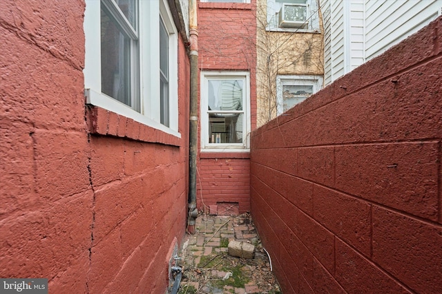 view of property exterior with brick siding