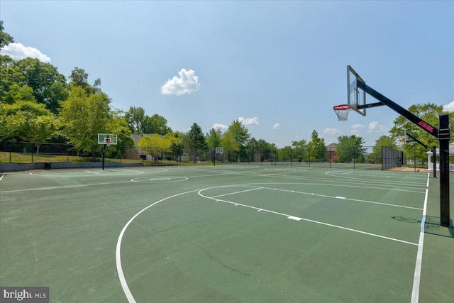 view of sport court with community basketball court and fence