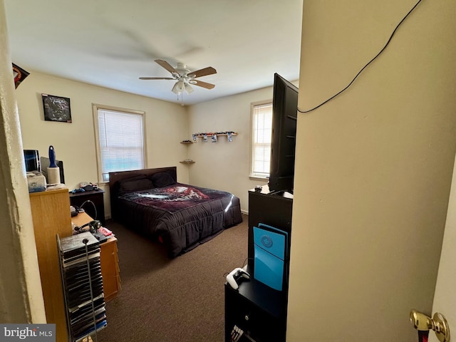 carpeted bedroom with a ceiling fan