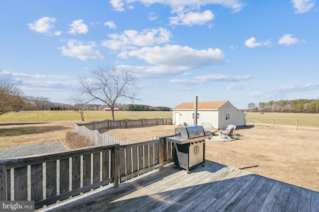 deck featuring fence, area for grilling, and a rural view