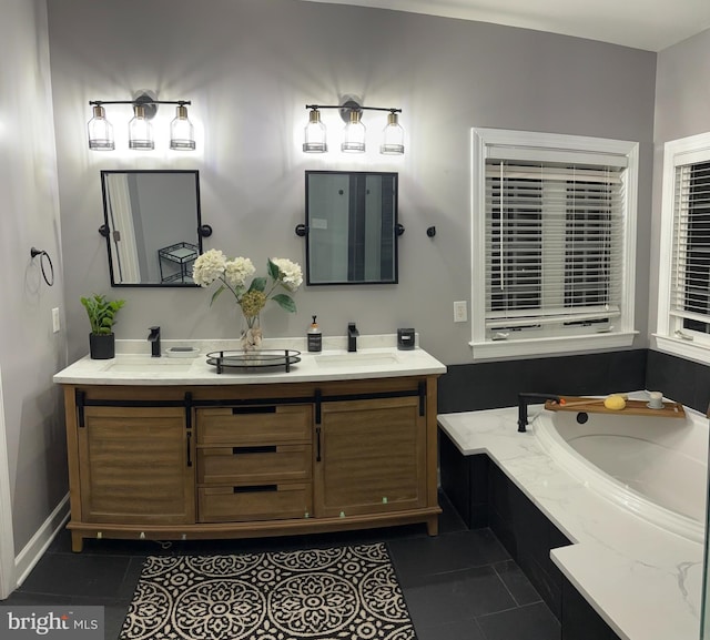 bathroom featuring tile patterned floors, a washtub, double vanity, and a sink