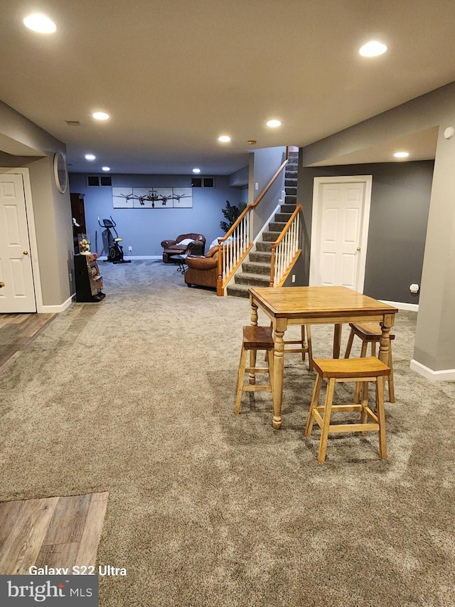 dining room featuring stairway, baseboards, carpet, and visible vents