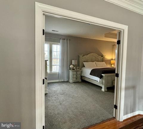 bedroom featuring carpet flooring and baseboards