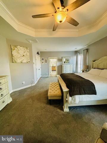 carpeted bedroom with a ceiling fan, a raised ceiling, baseboards, and ornamental molding