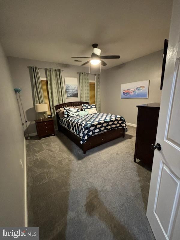 bedroom featuring visible vents, carpet flooring, a ceiling fan, and baseboards