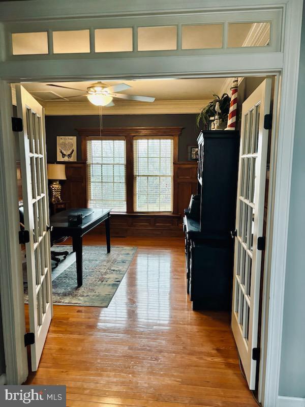 office area featuring ornamental molding, french doors, and wood finished floors