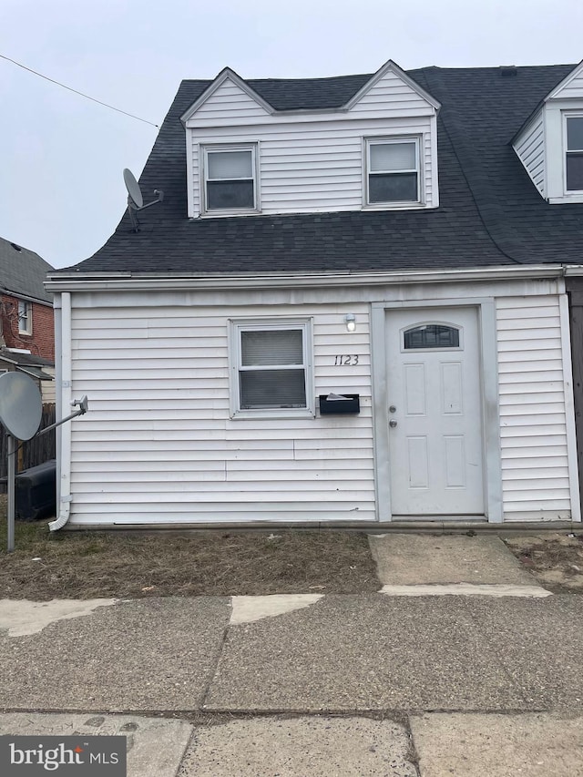 view of front of house featuring roof with shingles