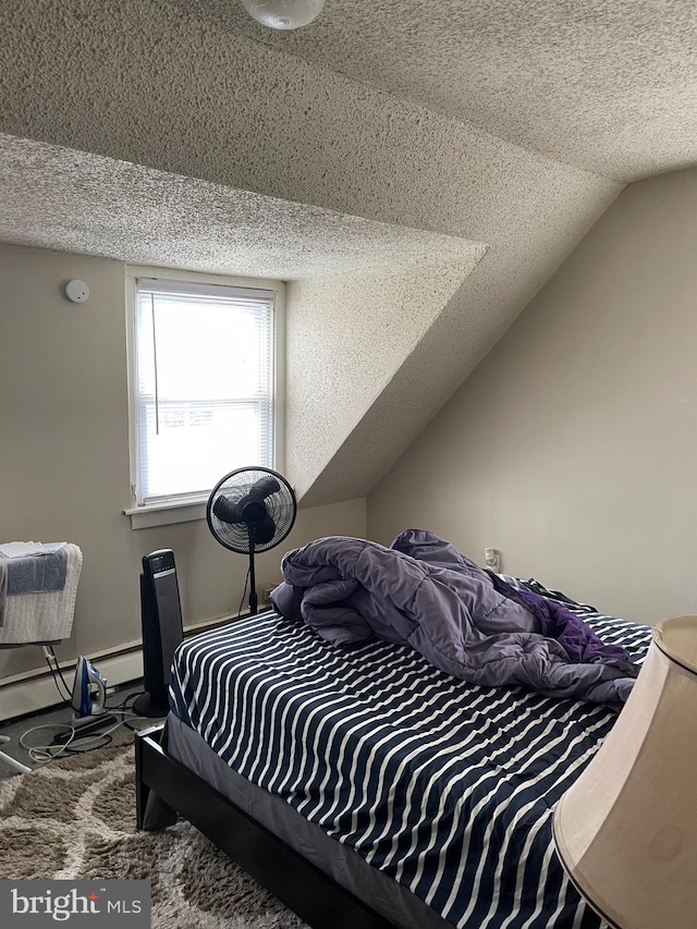 carpeted bedroom with a textured ceiling, baseboard heating, lofted ceiling, and baseboards