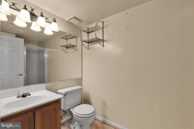 full bathroom with visible vents, baseboards, toilet, vanity, and a shower stall