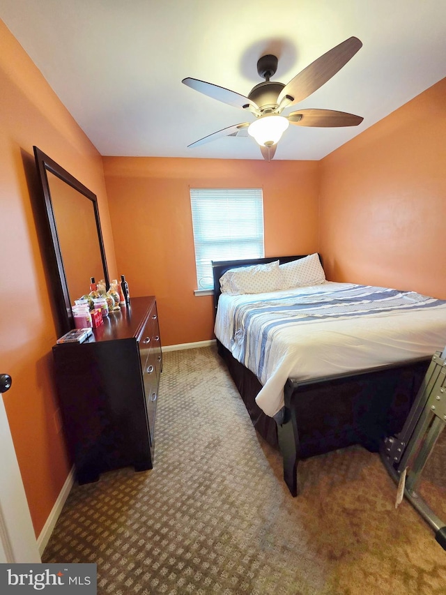 bedroom with carpet, baseboards, and ceiling fan