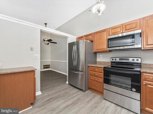 kitchen featuring ceiling fan, visible vents, baseboards, appliances with stainless steel finishes, and light wood-type flooring