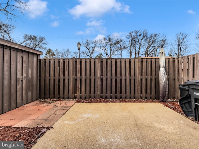 view of patio / terrace featuring fence