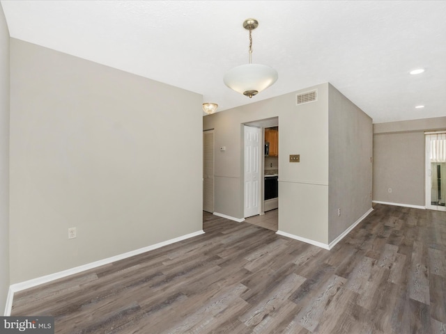 interior space featuring recessed lighting, visible vents, baseboards, and wood finished floors