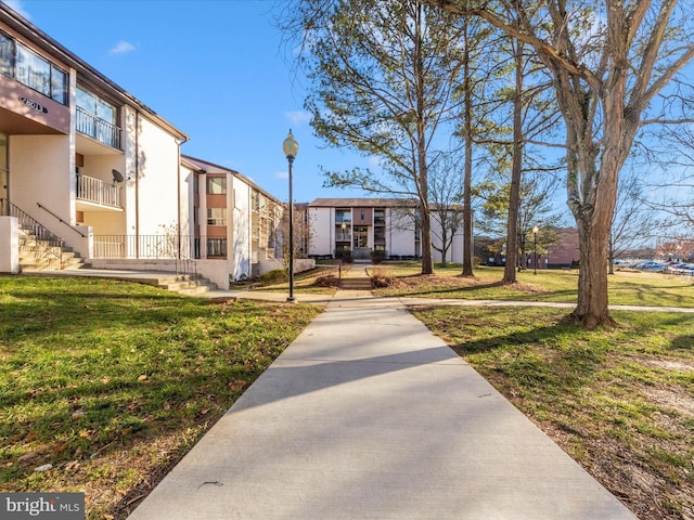 view of community with a lawn and a residential view