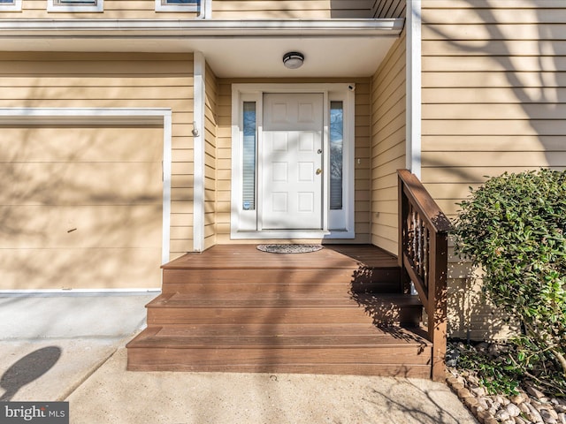 view of exterior entry featuring a garage