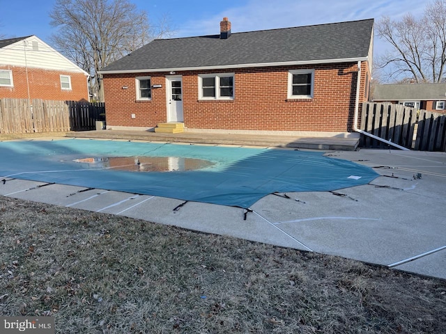 view of pool featuring a patio area, fence, and a fenced in pool