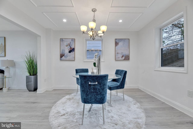 dining room featuring a chandelier, light wood-type flooring, baseboards, and recessed lighting