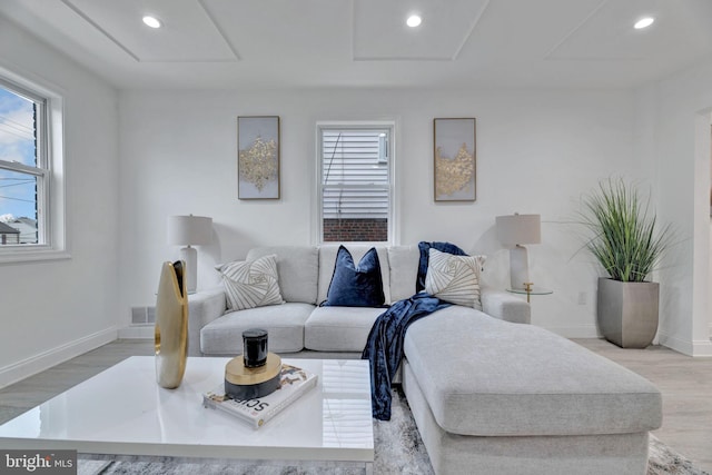 living room with recessed lighting and light wood finished floors