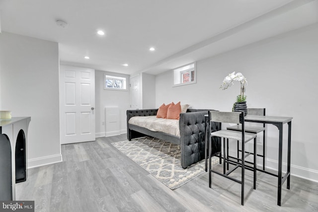 bedroom with recessed lighting, baseboards, and light wood finished floors