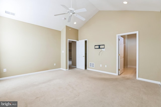 unfurnished bedroom with light carpet, high vaulted ceiling, baseboards, and visible vents