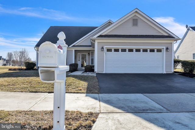 view of front facade with driveway and an attached garage