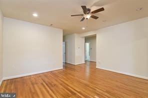 unfurnished room with ceiling fan, baseboards, wood finished floors, and recessed lighting