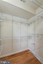 spacious closet with wood finished floors