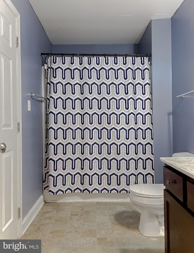 bathroom featuring toilet, shower / bathtub combination with curtain, and vanity