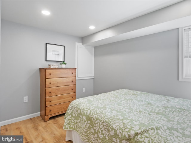 bedroom with recessed lighting, baseboards, and light wood-style flooring