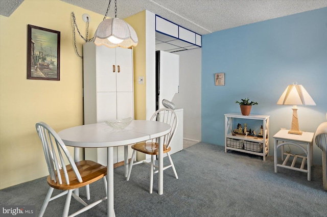 carpeted dining area with a textured ceiling