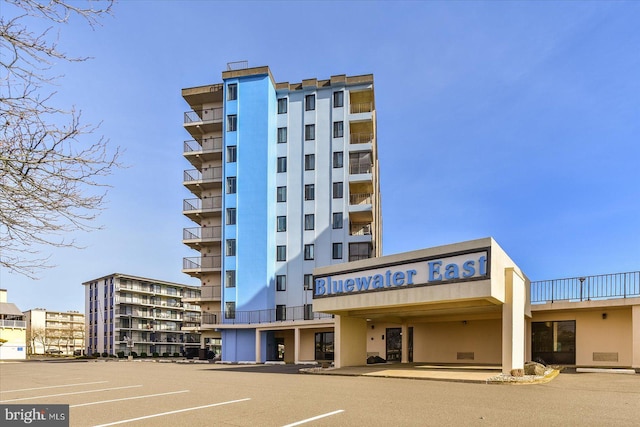 view of property featuring uncovered parking