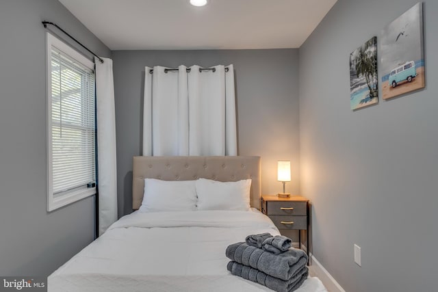 bedroom featuring baseboards