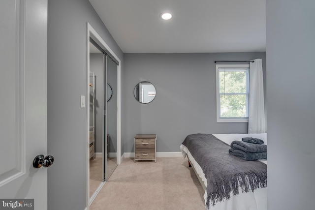 bedroom with carpet, baseboards, a closet, and recessed lighting