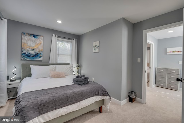 bedroom featuring recessed lighting, light carpet, and baseboards