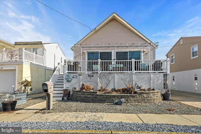 view of front of property featuring stairs