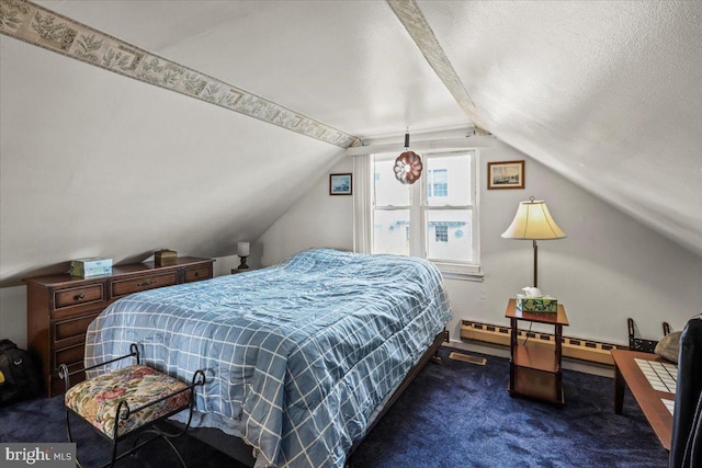 bedroom with vaulted ceiling, dark colored carpet, and a textured ceiling