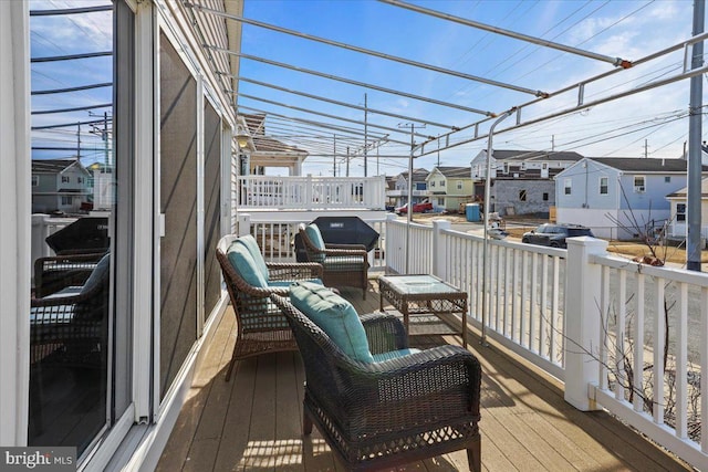 wooden terrace with a residential view