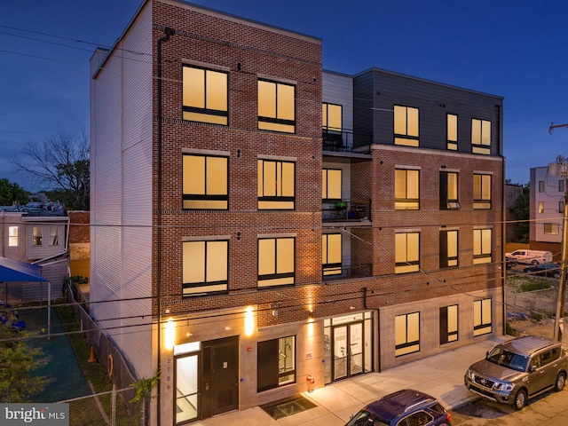 view of building exterior with fence