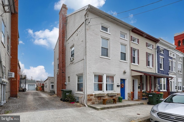 townhome / multi-family property featuring brick siding